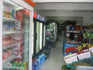 a store aisle of a grocery store filled with food at Vossos Hotel Apartments in Laganas