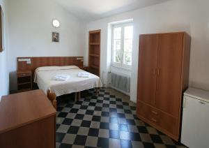 Un pat sau paturi într-o cameră la Santuario NS Soviore Cinque Terre