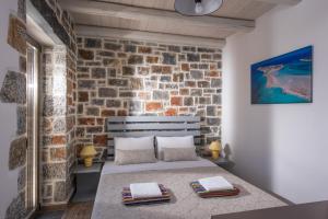 Säng eller sängar i ett rum på Gregory Luxury Villa Cretevasion
