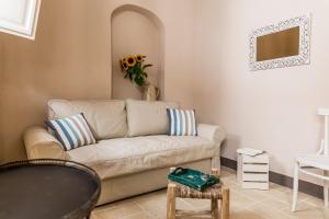 a living room with a couch and a table at Borgo San Gaetano in Bernalda