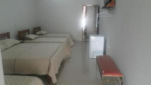 Ένα ή περισσότερα κρεβάτια σε δωμάτιο στο Arym Hotel