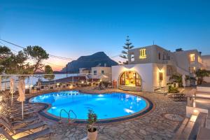 a swimming pool in the middle of a resort at Kalypso Studios in Myrties