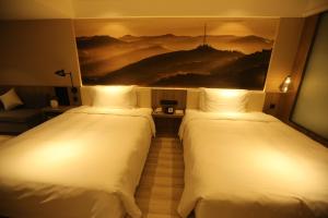 Postel nebo postele na pokoji v ubytování Atour Hotel Shuangyong Ave