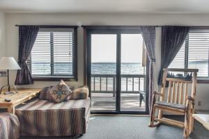 a room with a bed, chair and a window at Franciscan Lakeside Lodge in Tahoe Vista