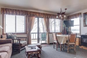 a living room with a table and a couch at Franciscan Lodge in Tahoe Vista