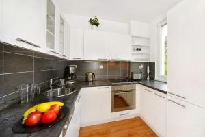 Kuchyň nebo kuchyňský kout v ubytování Apartment 91/65 Špindlerův Mlýn