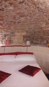 Letto o letti in una camera di Tutte le Albe nei Sassi