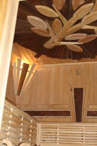 a ceiling with a painting of a plant on it at Hotel Yasenki in Yasenki