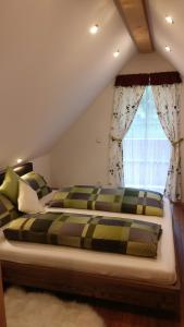 Кровать или кровати в номере Winzerhaus im Schilcherland