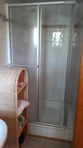 a shower with a glass door in a bathroom at Haus Kerschbaumer in Rangersdorf