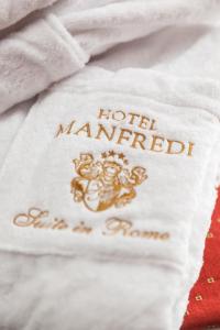 Postel nebo postele na pokoji v ubytování Hotel Manfredi Suite In Rome