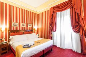 Postel nebo postele na pokoji v ubytování Hotel Manfredi Suite In Rome