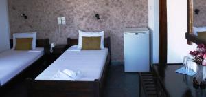 Postel nebo postele na pokoji v ubytování Elvira Hotel + 34 fotografií