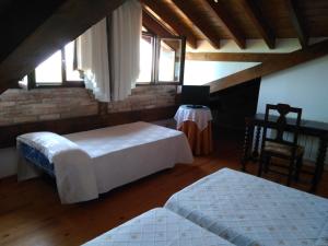 מיטה או מיטות בחדר ב-Casa Albertino