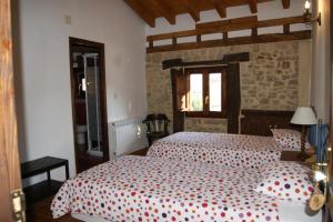 Llit o llits en una habitació de Don Baldomero Hotel Rural
