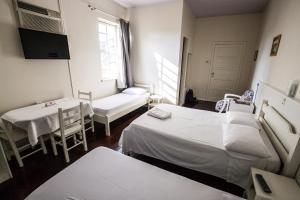 Postel nebo postele na pokoji v ubytování Hotel Pousada XV