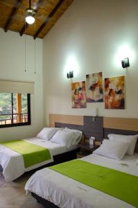 Krevet ili kreveti u jedinici u objektu Hotel La Montaña San Gil
