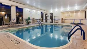 a large swimming pool in a hotel room at Best Western Plus Mishawaka Inn in South Bend