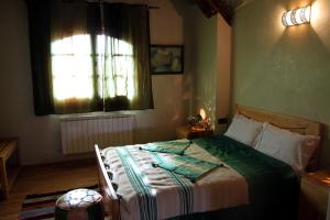 a bedroom with a bed and a window at La pommeraie d'Ifrane in Ifrane +89 photos