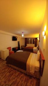 Postel nebo postele na pokoji v ubytování Libertad Hotel