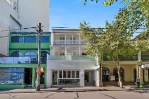 a building on the corner of a city street at Sydney Boutique Hotel in Sydney