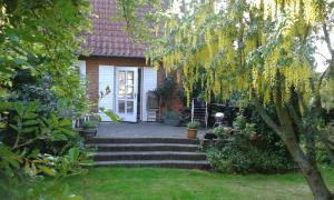 a house with stairs leading to the front door at Porshøjvej in Skive