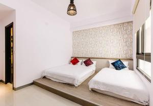 Ένα ή περισσότερα κρεβάτια σε δωμάτιο στο Travel Mind