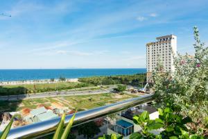 a view of the ocean and a building at Salamander Apartment hotel in Da Nang