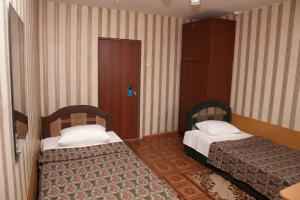 Un ou plusieurs lits dans un hébergement de l'établissement Chita Hotel