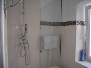 Ванная комната в Apartments Dobrinj