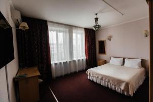 Voodi või voodid majutusasutuse Hotel Zhambyl toas