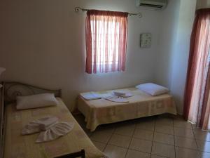 Postel nebo postele na pokoji v ubytování Panorama Elafonisos