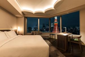 a bedroom with a bed and a view of the eiffel tower at The Prince Park Tower Tokyo - Preferred Hotels & Resorts, LVX Collection in Tokyo