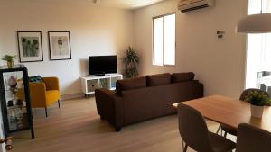 TV a/nebo společenská místnost v ubytování Caputxins Apartment