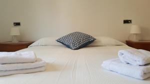 Postel nebo postele na pokoji v ubytování Caputxins Apartment