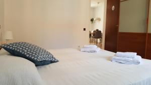 Postel nebo postele na pokoji v ubytování Caputxins Apartment