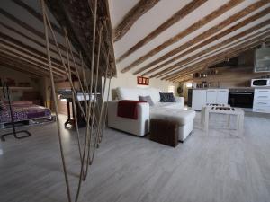 a living room with a white couch and a table at 18 Torres in Zaragoza