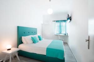 Posteľ alebo postele v izbe v ubytovaní Acqua Vatos Paros Hotel
