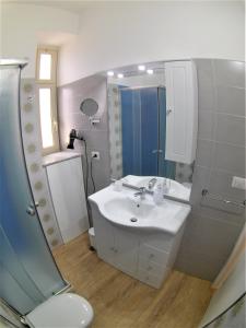 Ванна кімната в Duomo Sant'Agata Apartments