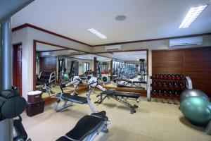a gym with several exercise bikes in a room at Baros Maldives in Male City
