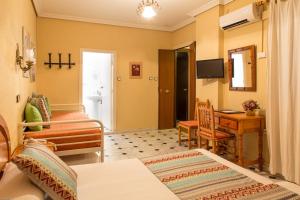 Μια τηλεόραση ή/και κέντρο ψυχαγωγίας στο Bed & Breakfast Naranjo