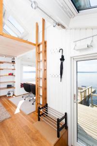 a room with a loft bed and a desk at Beach house in Oslo in Oslo