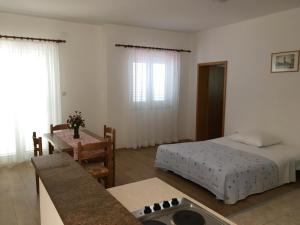 Postel nebo postele na pokoji v ubytování Apartments Villa Emilija