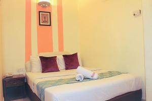 Postel nebo postele na pokoji v ubytování Sun Inns Hotel Puchong
