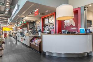 a store with a large counter in a store at Serways Hotel Heiligenroth in Montabaur