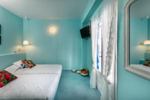 Voodi või voodid majutusasutuse Ios Resort toas