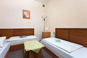Postel nebo postele na pokoji v ubytování Penzion Hotel Morrison