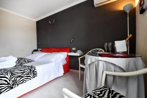 Postel nebo postele na pokoji v ubytování Hotel La Sacca