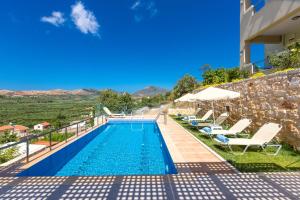 The swimming pool at or near Kampos Villas, pure elegance!
