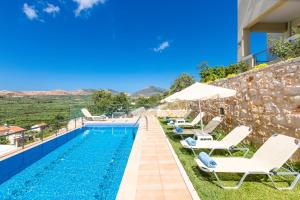 The swimming pool at or near Kampos Villas, pure elegance!